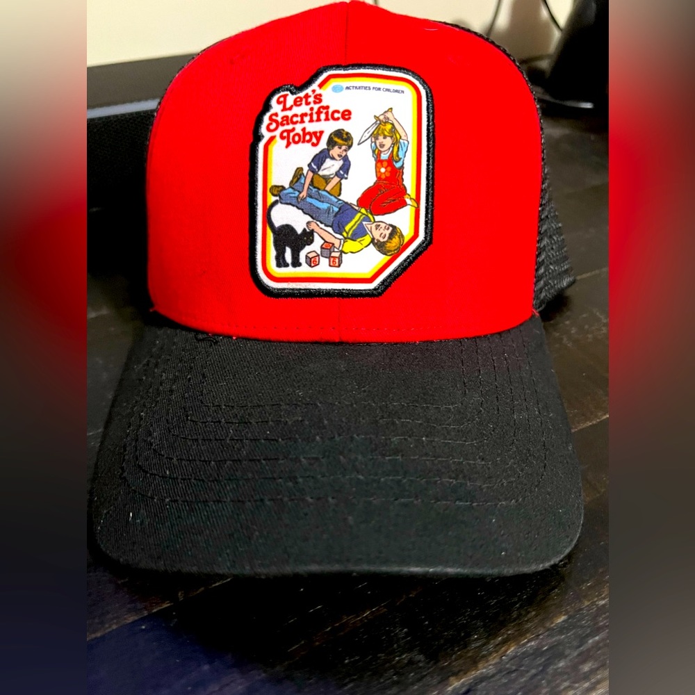 Spencer’s Steven Rhodes red and black retro let’s sacrifice Toby SnapBack hat